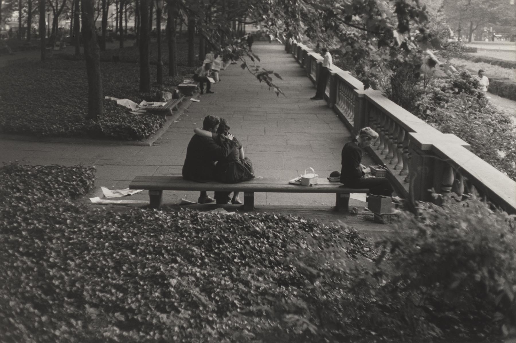 A silver gelatin print by Roy DeCarava titled Couple and lady, Bryant Park, dated 1963